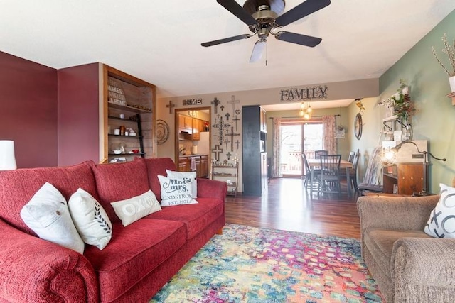 living area featuring wood finished floors and a ceiling fan