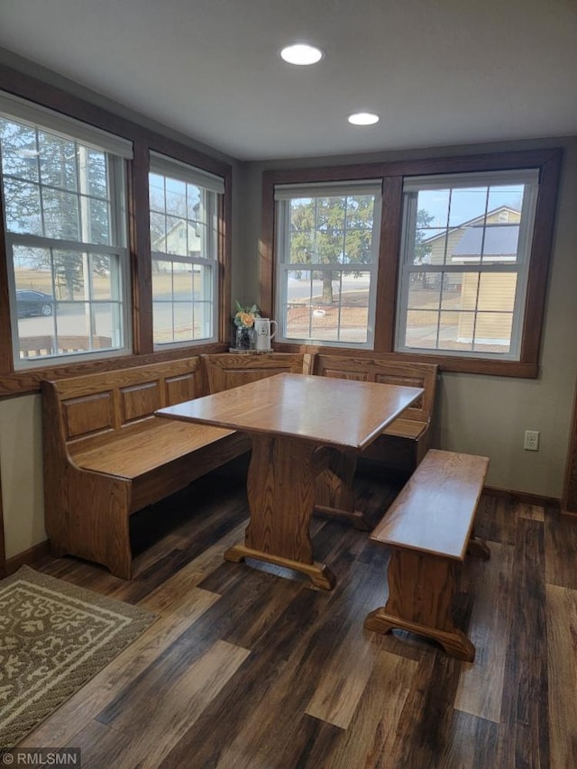 dining area featuring recessed lighting, breakfast area, baseboards, and wood finished floors