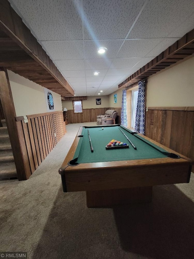 game room featuring carpet, wood walls, and wainscoting