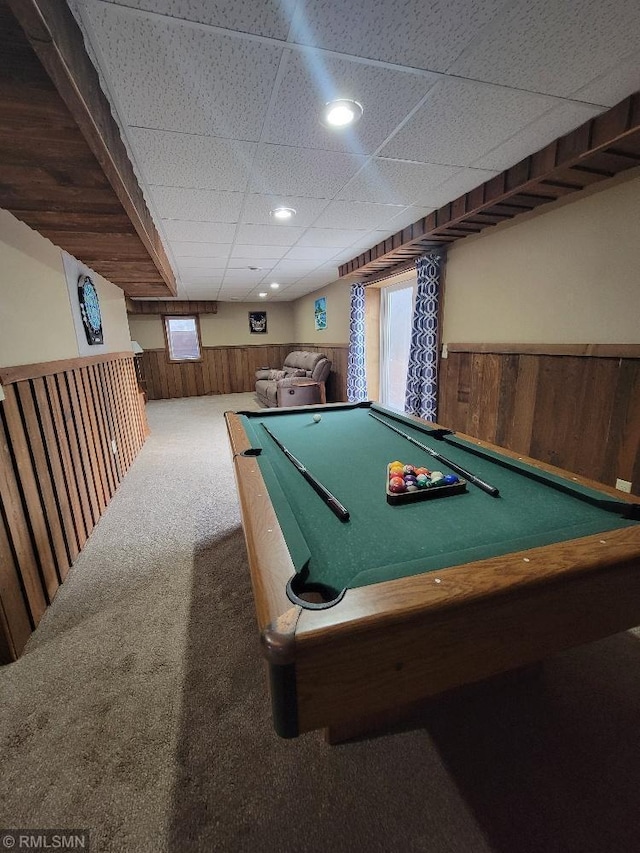 game room featuring a wainscoted wall, carpet floors, recessed lighting, a drop ceiling, and wood walls