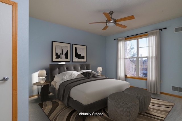 carpeted bedroom with baseboards, visible vents, and ceiling fan