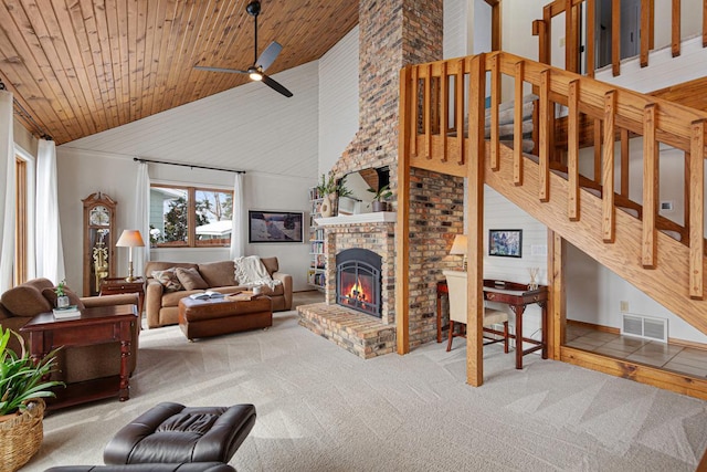 living room featuring wooden ceiling, a fireplace, visible vents, and carpet floors