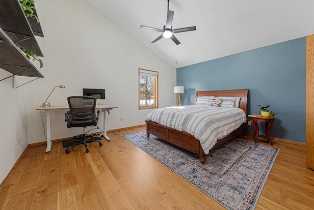 bedroom featuring ceiling fan, baseboards, and wood finished floors