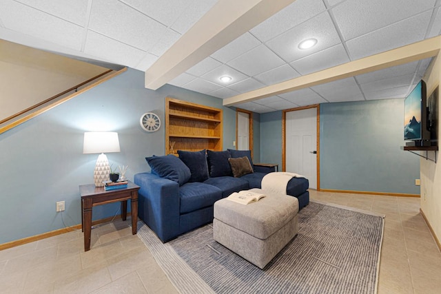 living area with tile patterned flooring, recessed lighting, baseboards, and a drop ceiling