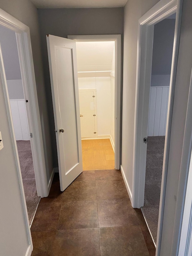 hallway featuring baseboards