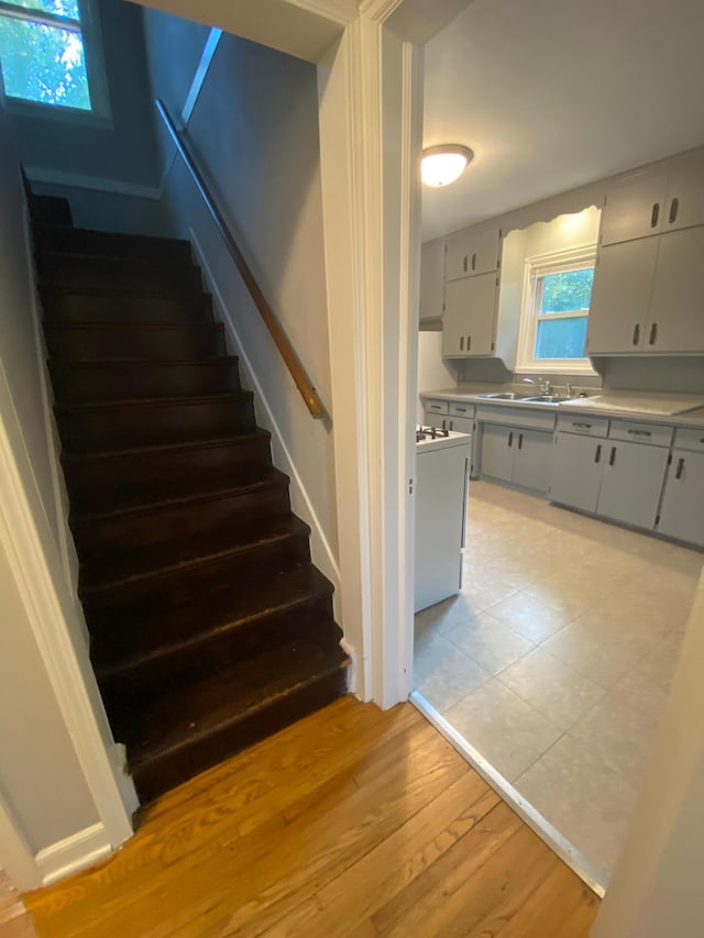 staircase with wood finished floors