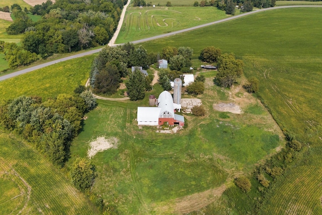 birds eye view of property with a rural view