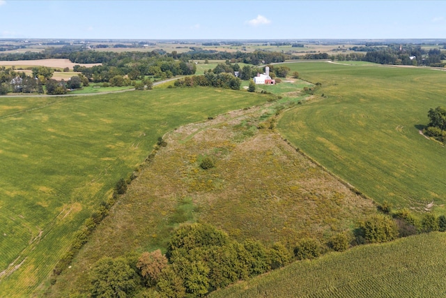 birds eye view of property with a rural view