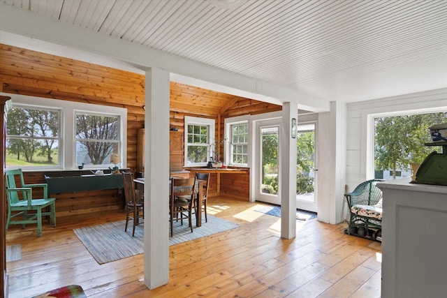 sunroom / solarium featuring wood ceiling and vaulted ceiling