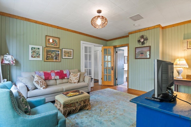 living room featuring visible vents and wood finished floors