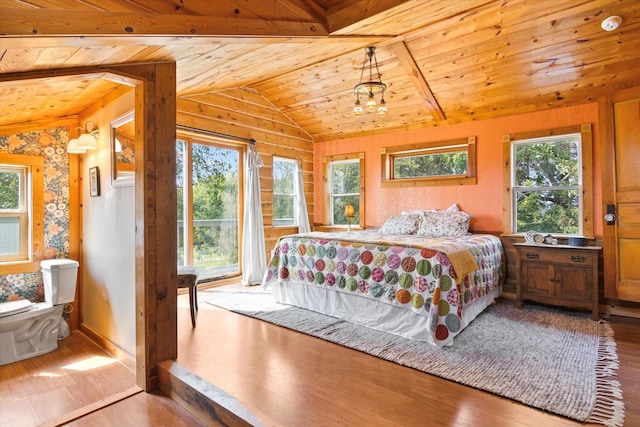 bedroom with wood finished floors, wooden ceiling, and vaulted ceiling with beams