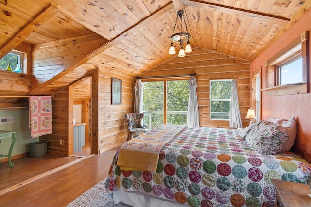 bedroom featuring wood finished floors, wooden ceiling, wood walls, and vaulted ceiling