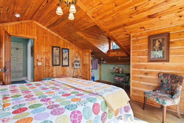 bedroom with wood finished floors, wooden walls, an inviting chandelier, wooden ceiling, and lofted ceiling