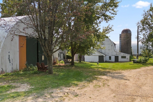 view of yard with a barn and an outdoor structure