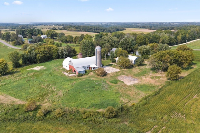 birds eye view of property with a rural view