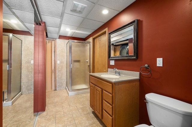 full bathroom featuring visible vents, a shower stall, vanity, and toilet