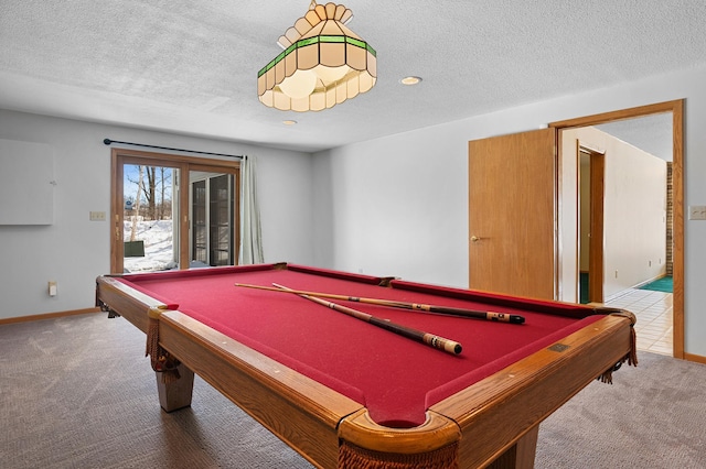 recreation room featuring baseboards, a textured ceiling, billiards, and carpet