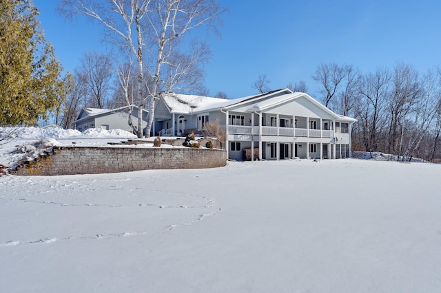 view of snow covered house