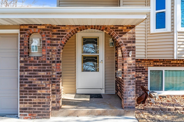 entrance to property featuring stone siding