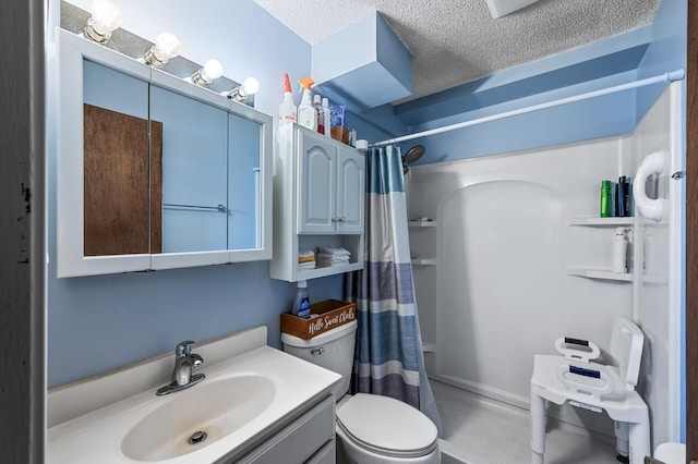 bathroom with curtained shower, toilet, vanity, and a textured ceiling