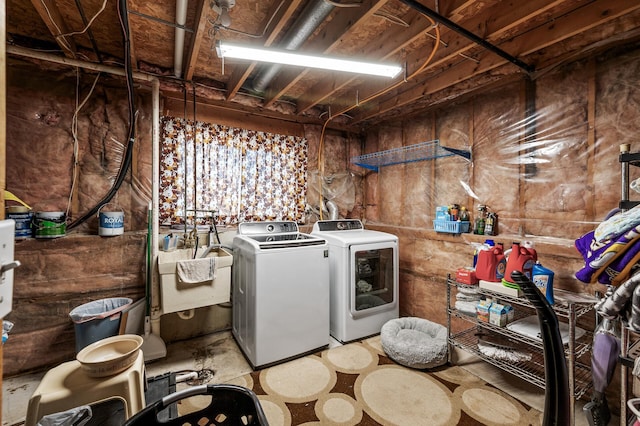 laundry area featuring a sink, laundry area, and washing machine and clothes dryer