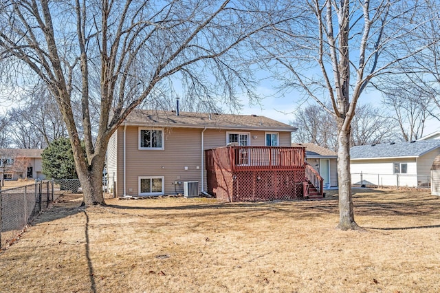 back of house featuring stairway, a wooden deck, central AC unit, a lawn, and a fenced backyard