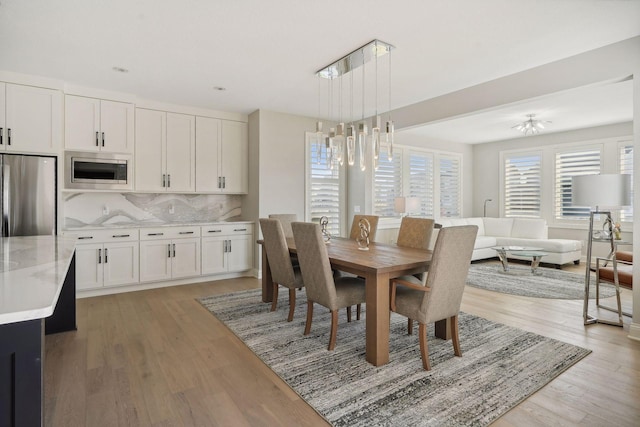 dining area with light wood finished floors