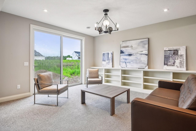 living area with a chandelier, recessed lighting, baseboards, and carpet