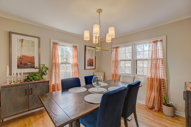 5920 Colfax Ave S, Minneapolis, MN 55419 - dining room with crown molding, baseboards, a chandelier, and light wood-style flooring