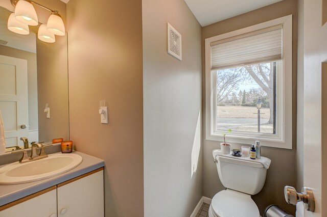 5920 Colfax Ave S, Minneapolis, MN 55419 - bathroom featuring visible vents, tile patterned flooring, vanity, toilet, and baseboards