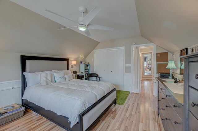 5920 Colfax Ave S, Minneapolis, MN 55419 - bedroom featuring wainscoting, ceiling fan, vaulted ceiling, and light wood-type flooring