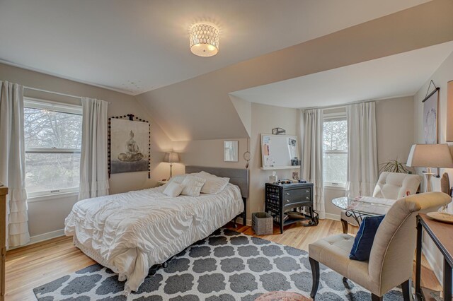 5920 Colfax Ave S, Minneapolis, MN 55419 - bedroom featuring baseboards, vaulted ceiling, and wood finished floors