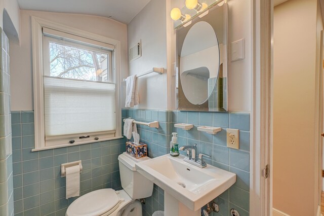 5920 Colfax Ave S, Minneapolis, MN 55419 - half bathroom featuring a sink, tile walls, and toilet
