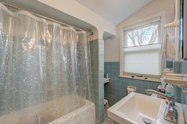 5920 Colfax Ave S, Minneapolis, MN 55419 - bathroom with a sink, tile walls, shower / tub combo, and lofted ceiling