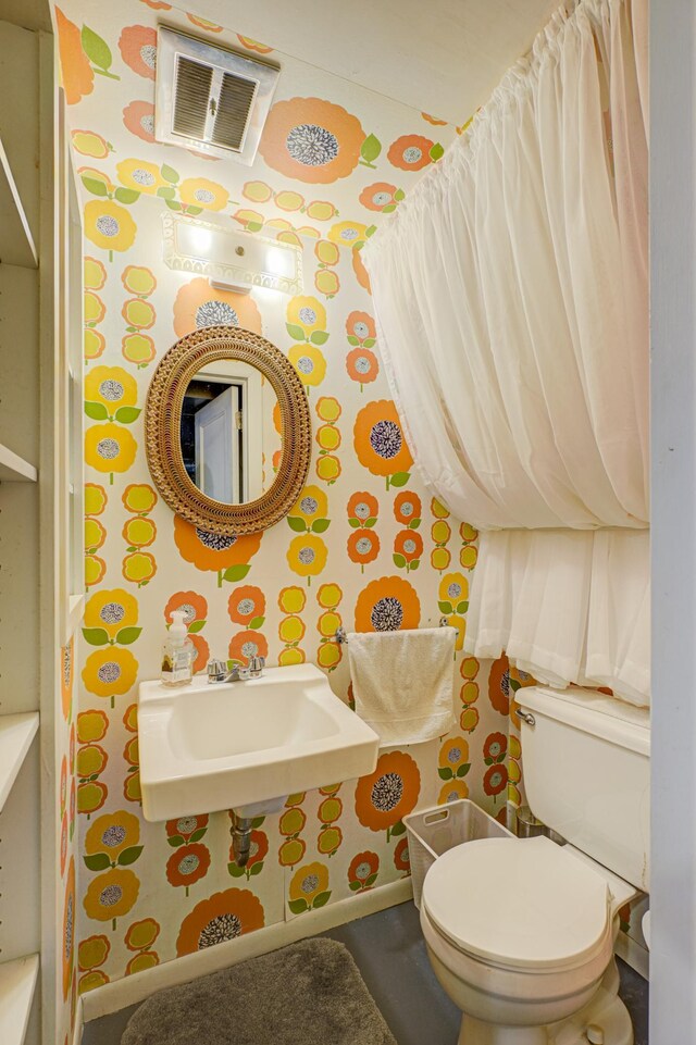5920 Colfax Ave S, Minneapolis, MN 55419 - half bath with toilet, wallpapered walls, visible vents, and a sink