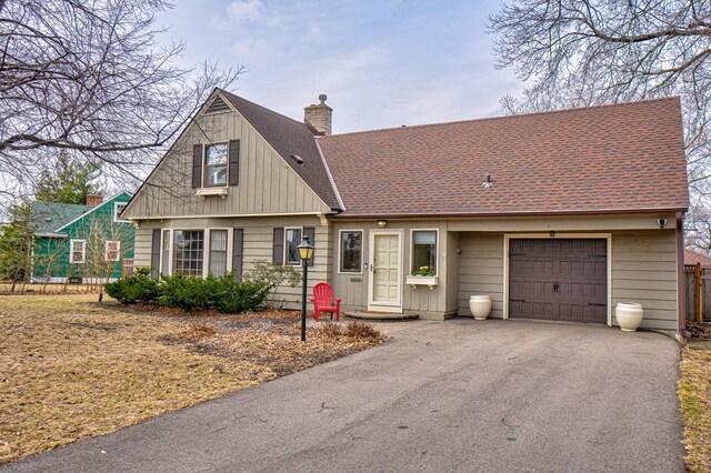5920 Colfax Ave S, Minneapolis, MN 55419 - view of front of property featuring driveway, a chimney, a shingled roof, and a garage
