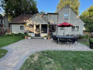 5920 Colfax Ave S, Minneapolis, MN 55419 - back of house featuring fence, a yard, and a patio area