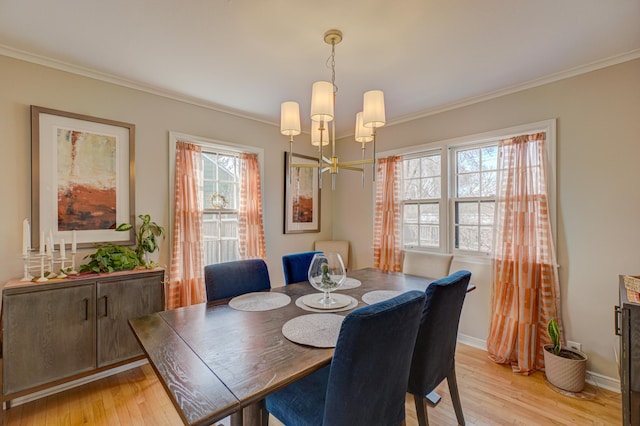 5920 Colfax Ave S, Minneapolis, MN 55419 - dining area with ornamental molding, light wood-type flooring, a chandelier, and baseboards