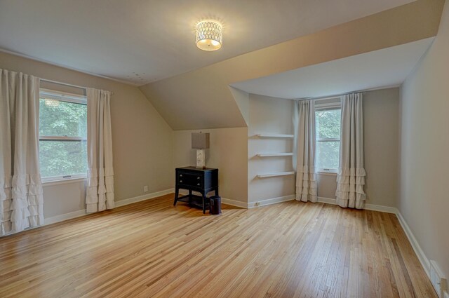5920 Colfax Ave S, Minneapolis, MN 55419 - additional living space featuring hardwood / wood-style flooring, baseboards, and lofted ceiling