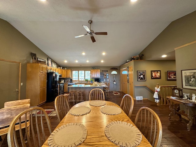 dining space featuring visible vents, dark wood-type flooring, recessed lighting, ceiling fan, and vaulted ceiling