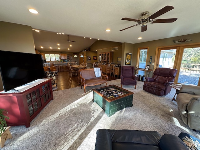 living area featuring visible vents, recessed lighting, lofted ceiling, and ceiling fan