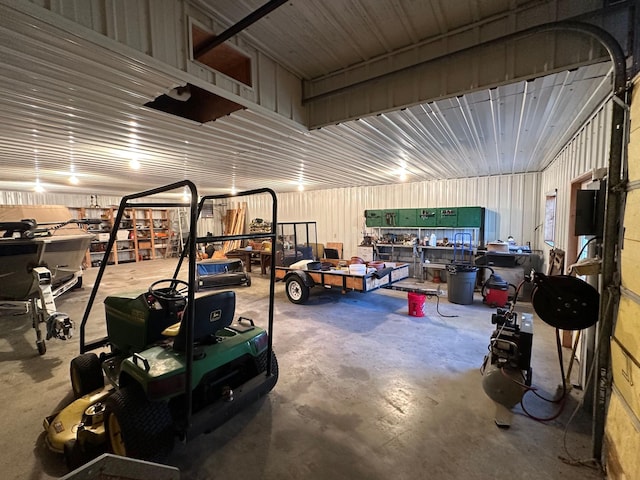 garage with a workshop area and metal wall