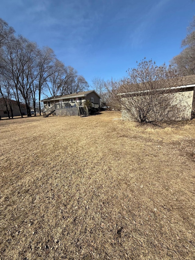 view of yard featuring a wooden deck