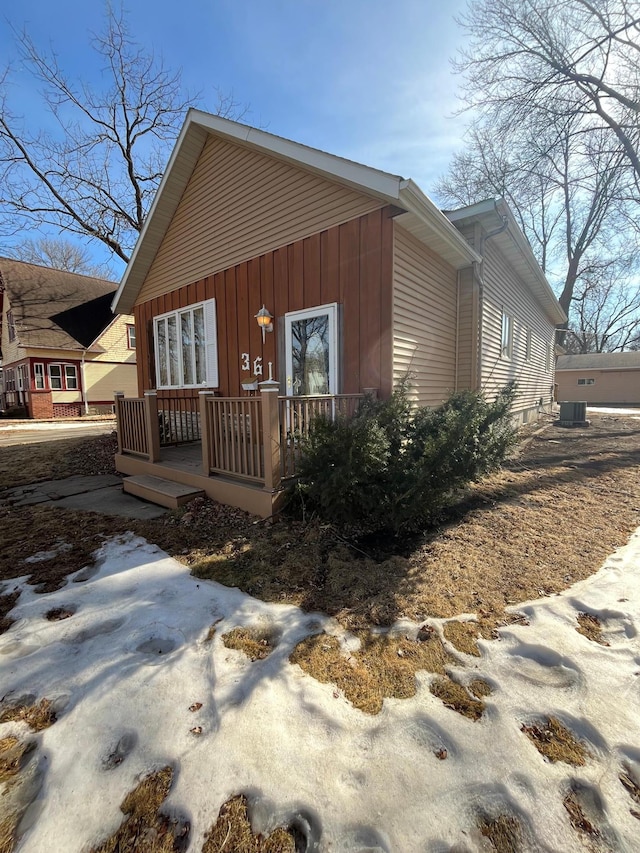 view of side of home featuring a porch