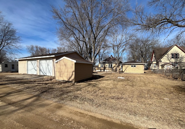 361 Hollett St, Tracy, MN 56175 - view of yard with an outdoor structure and a garage