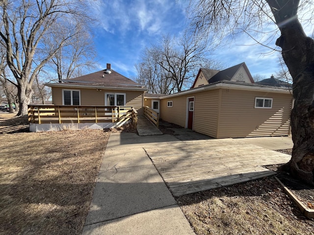 361 Hollett St, Tracy, MN 56175 - back of house featuring a deck and a chimney