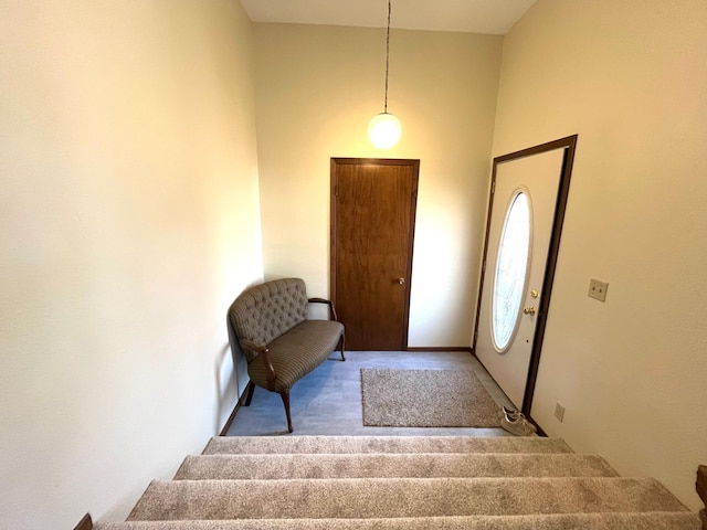 361 Hollett St, Tracy, MN 56175 - carpeted foyer entrance with stairway and a towering ceiling