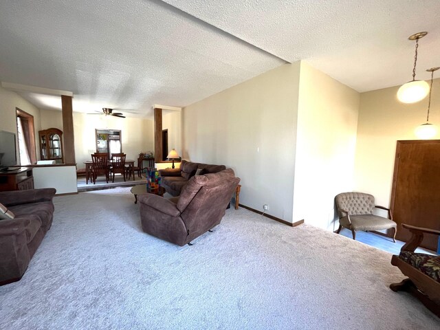 361 Hollett St, Tracy, MN 56175 - carpeted living area with a textured ceiling and ceiling fan