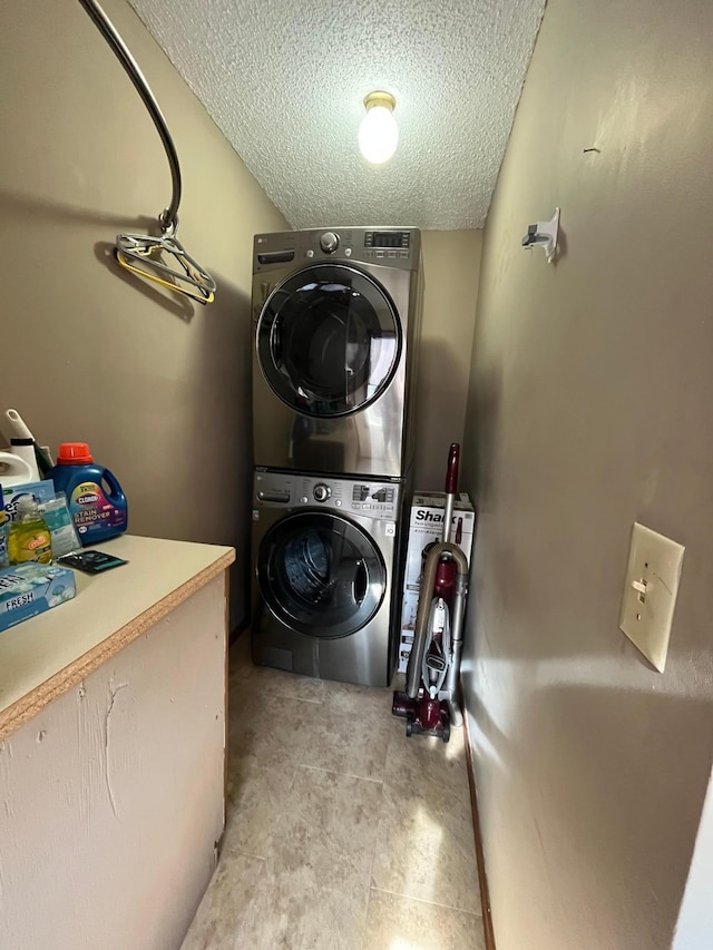 361 Hollett St, Tracy, MN 56175 - laundry area featuring stacked washer / dryer and a textured ceiling