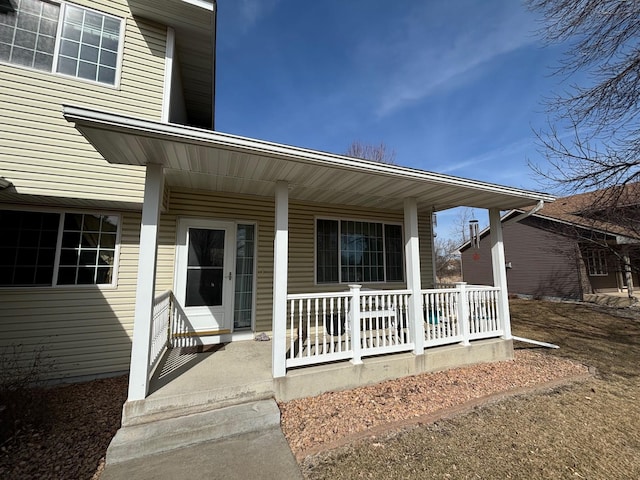 doorway to property featuring covered porch